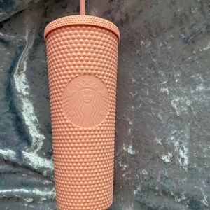 Pink studded Starbucks cup